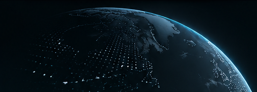 The curve of the Earth seen from space at night, its continents traced in points of light against a dark ocean.